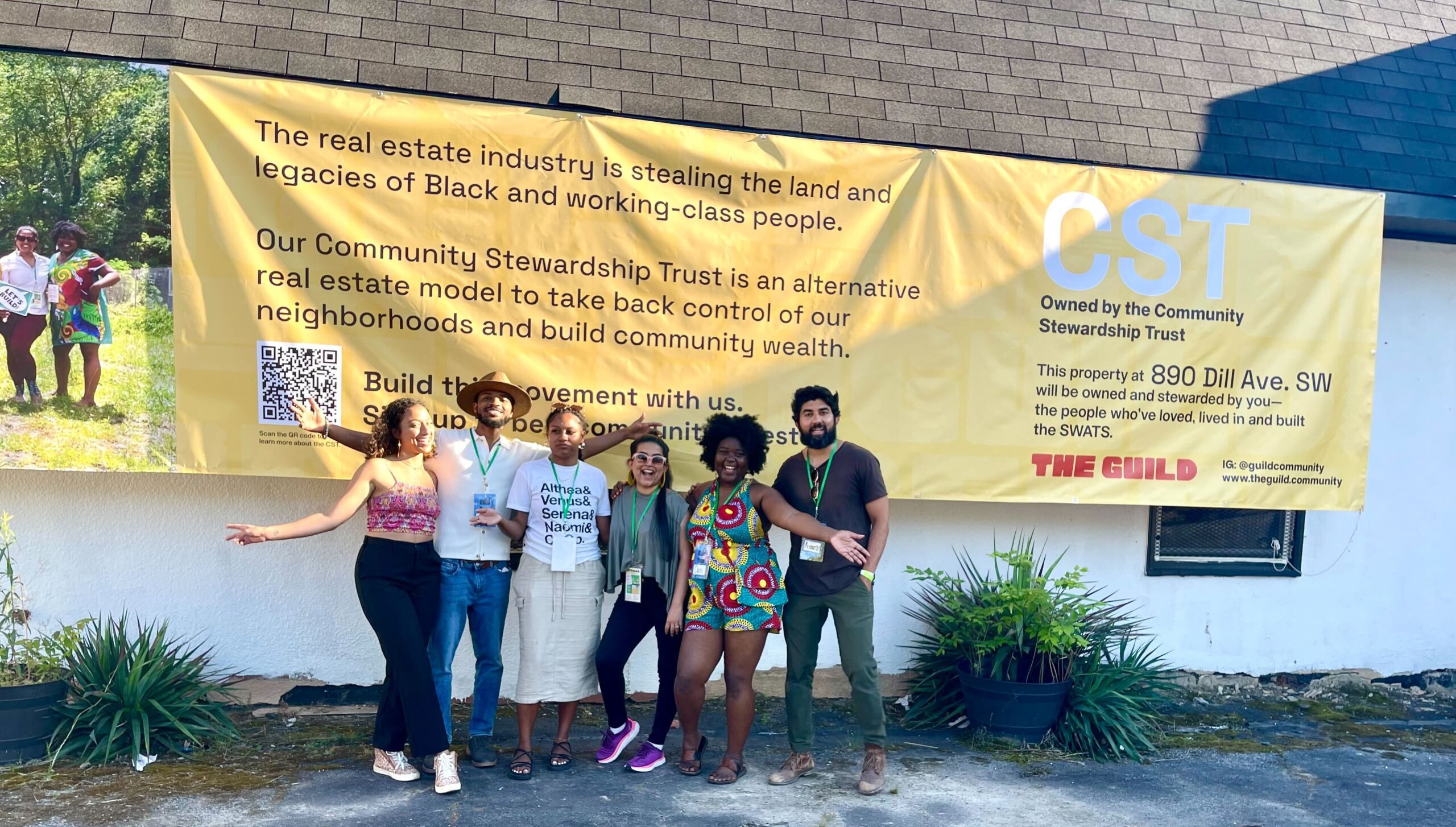 The Guild team poses in front of 890 Dill Ave